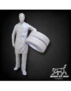 1:24 - Mechanic carrying tires