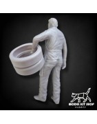 1:24 - Mechanic carrying tires