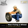 0 (1:43.5) - Homme fixant une roue