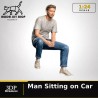 1:24 - Homme assis dans une voiture